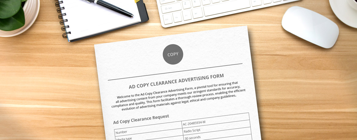 Ad copy clearance form on a desk