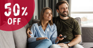 50% Off Sale - young couple looking at TV